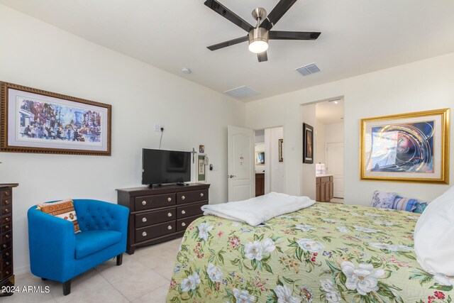 tiled bedroom with ceiling fan and connected bathroom