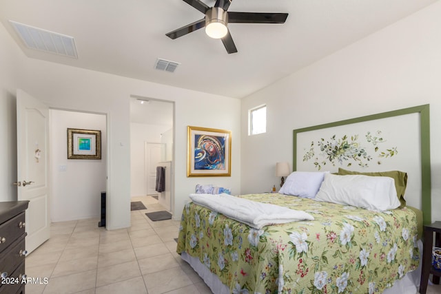 bedroom with ceiling fan and light tile flooring