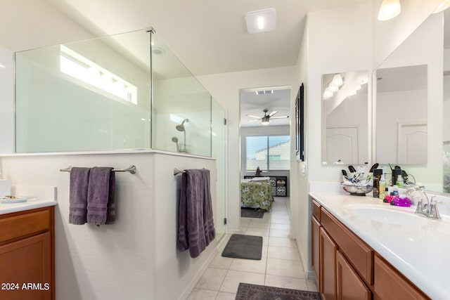 bathroom featuring vanity, tile floors, ceiling fan, and a shower with door