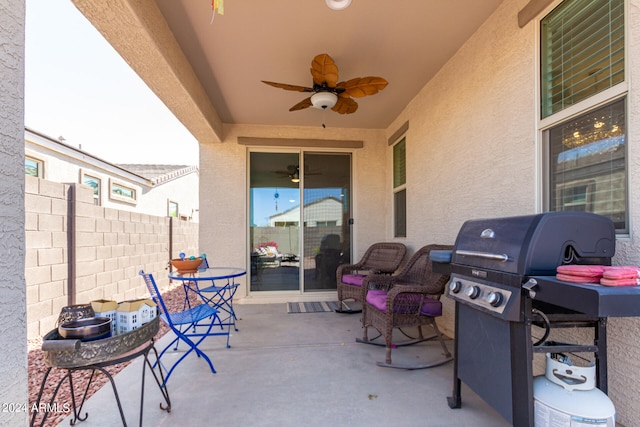 view of patio featuring area for grilling and ceiling fan