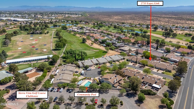 bird's eye view featuring a water and mountain view, a residential view, and view of golf course