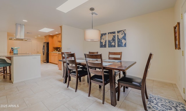 dining room with recessed lighting, light tile patterned floors, baseboards, visible vents, and a skylight