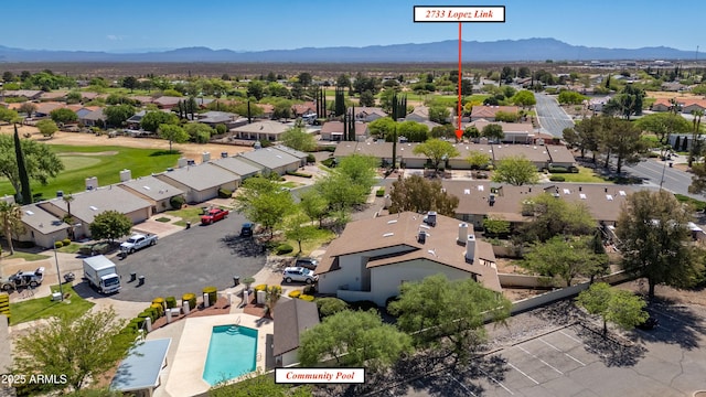aerial view featuring a mountain view and a residential view