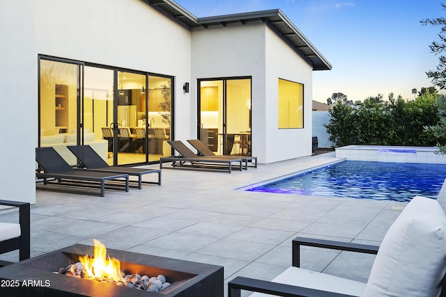 4002 N 33rd Pl, Phoenix, AZ 85018 - back of house featuring a patio area, an outdoor pool, an outdoor hot tub, and an outdoor living space with a fire pit