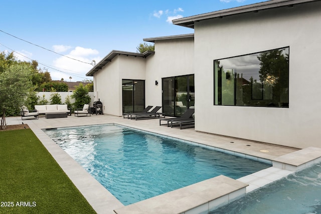 4002 N 33rd Pl, Phoenix, AZ 85018 - back of house featuring an outdoor living space, a patio area, and stucco siding