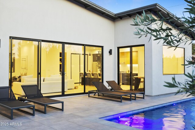 4002 N 33rd Pl, Phoenix, AZ 85018 - back of house featuring a patio, stucco siding, and an outdoor pool