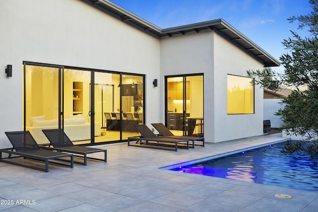 4002 N 33rd Pl, Phoenix, AZ 85018 - back of property with a patio area, an outdoor pool, and stucco siding