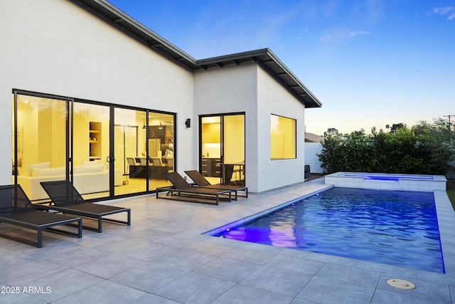 4002 N 33rd Pl, Phoenix, AZ 85018 - rear view of house with a patio, an in-ground hot tub, an outdoor pool, and stucco siding