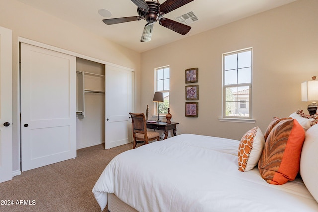 bedroom featuring a closet, carpet floors, and ceiling fan