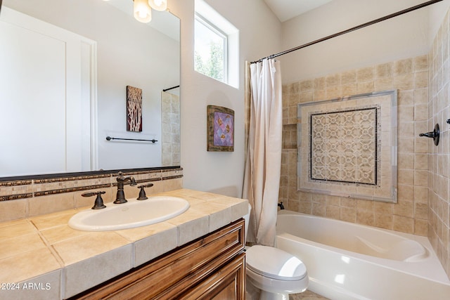 full bathroom featuring shower / bath combination with curtain, toilet, and vanity