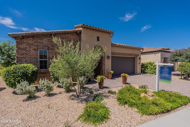 view of front of property with a garage