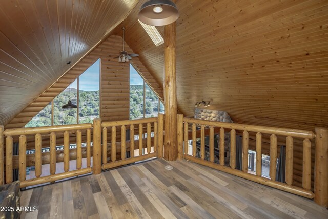 4177 W Finch Hollow Ave, Chino Valley, AZ 86323 - additional living space featuring a mountain view, log walls, wood finished floors, wood ceiling, and high vaulted ceiling
