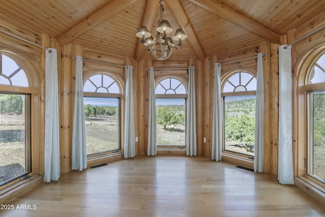 4177 W Finch Hollow Ave, Chino Valley, AZ 86323 - interior space with beamed ceiling, a wealth of natural light, and a notable chandelier