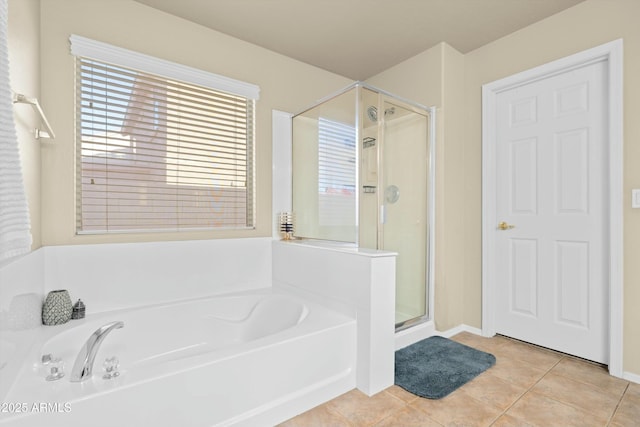 bathroom with shower with separate bathtub and tile patterned floors