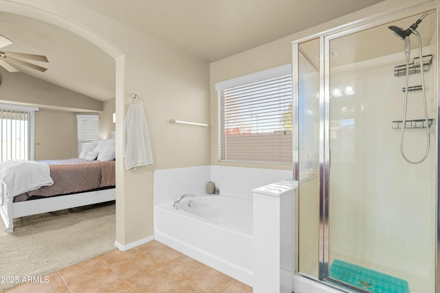 bathroom featuring tile patterned floors, ceiling fan, separate shower and tub, and lofted ceiling