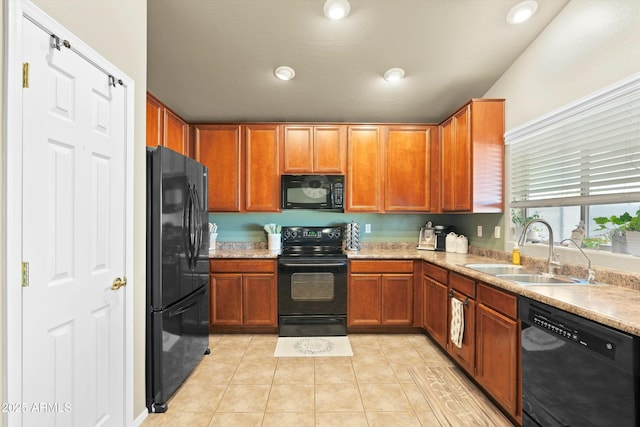 kitchen with sink, light tile patterned flooring, and black appliances