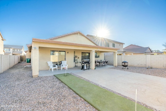 rear view of house with a patio area