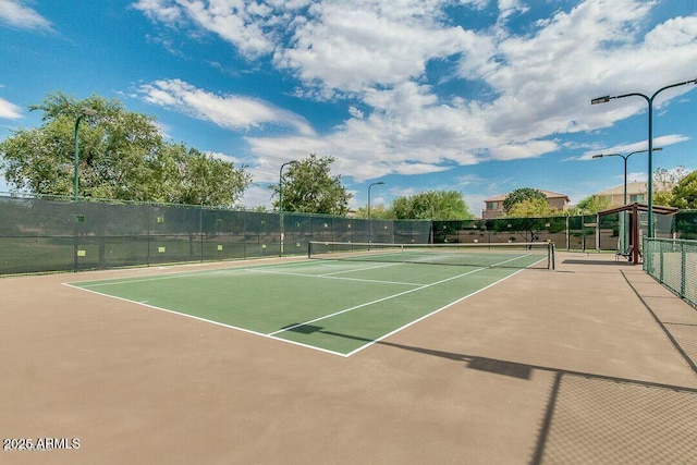 view of sport court with basketball hoop