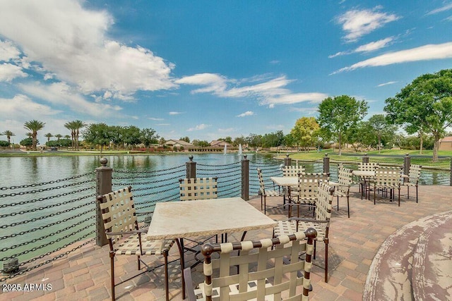 view of patio featuring a water view