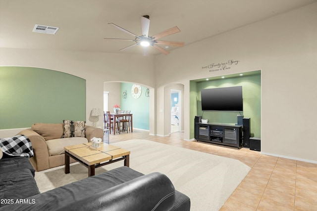 living room with tile patterned floors and ceiling fan