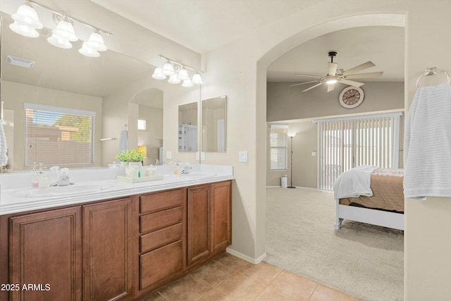 bathroom with tile patterned floors, ceiling fan, and vanity