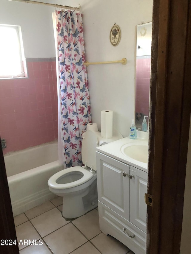 full bathroom featuring tile patterned floors, shower / bath combo, toilet, and vanity