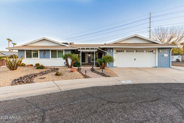 ranch-style house featuring a garage