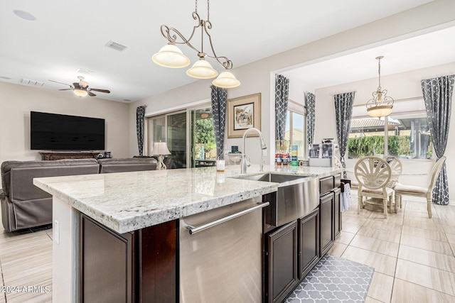 kitchen with stainless steel dishwasher, sink, dark brown cabinetry, decorative light fixtures, and ceiling fan