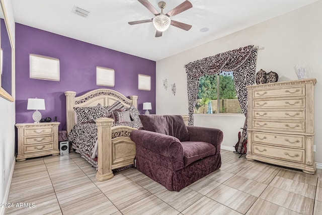 bedroom with ceiling fan and light tile patterned flooring