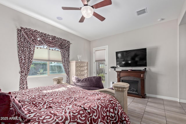 tiled bedroom with ceiling fan