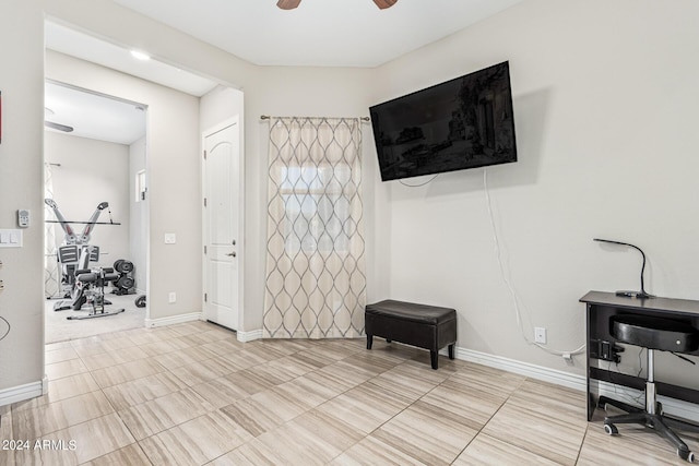 interior space featuring ceiling fan