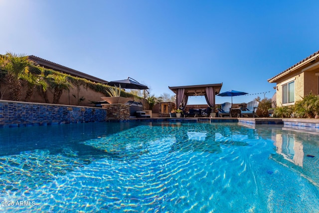 view of swimming pool featuring a gazebo