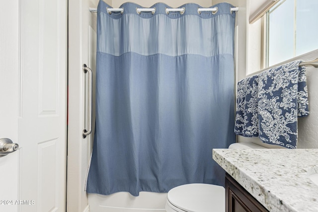 full bathroom featuring toilet, vanity, and shower / tub combo