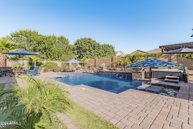 view of swimming pool with pool water feature, a patio area, a hot tub, and a pergola