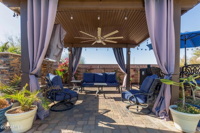 view of patio / terrace with ceiling fan and an outdoor hangout area