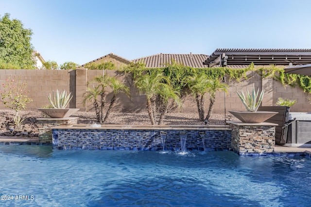 view of pool featuring a pergola and pool water feature