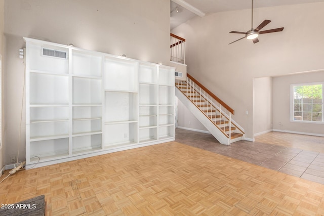 966 E Driftwood Dr, Tempe, AZ 85283 - unfurnished living room featuring a ceiling fan, stairway, high vaulted ceiling, beam ceiling, and baseboards