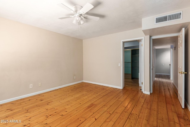 966 E Driftwood Dr, Tempe, AZ 85283 - unfurnished room featuring light wood-style floors, baseboards, and a ceiling fan