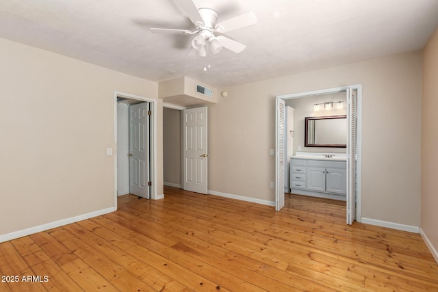966 E Driftwood Dr, Tempe, AZ 85283 - unfurnished bedroom featuring baseboards, light wood-style floors, a sink, ensuite bath, and a ceiling fan