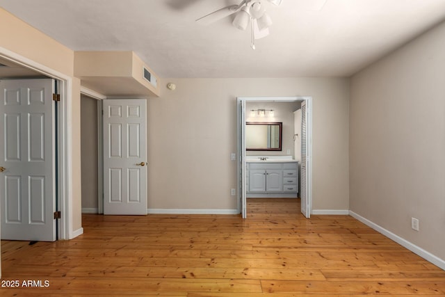966 E Driftwood Dr, Tempe, AZ 85283 - unfurnished bedroom with baseboards, light wood-style floors, ensuite bathroom, a sink, and ceiling fan
