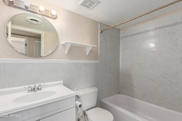 966 E Driftwood Dr, Tempe, AZ 85283 - bathroom featuring toilet, a textured ceiling, shower / bath combination, vanity, and tile walls