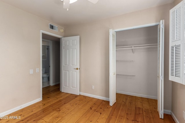 966 E Driftwood Dr, Tempe, AZ 85283 - unfurnished bedroom featuring light wood-style floors, a closet, baseboards, and a ceiling fan
