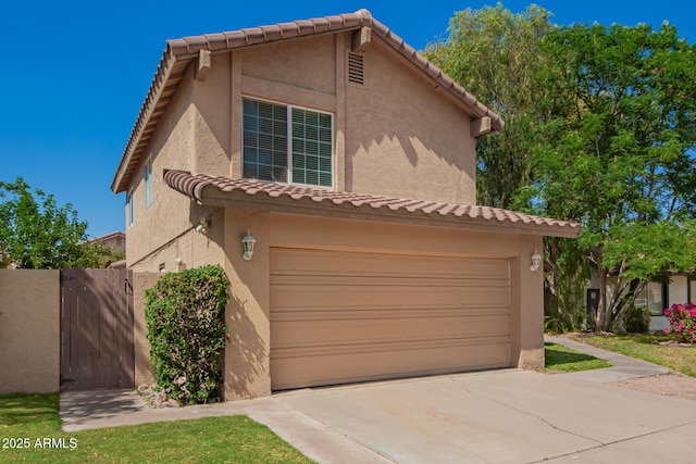 966 E Driftwood Dr, Tempe, AZ 85283 - view of front of property featuring a garage, a tiled roof, stucco siding, and a gate
