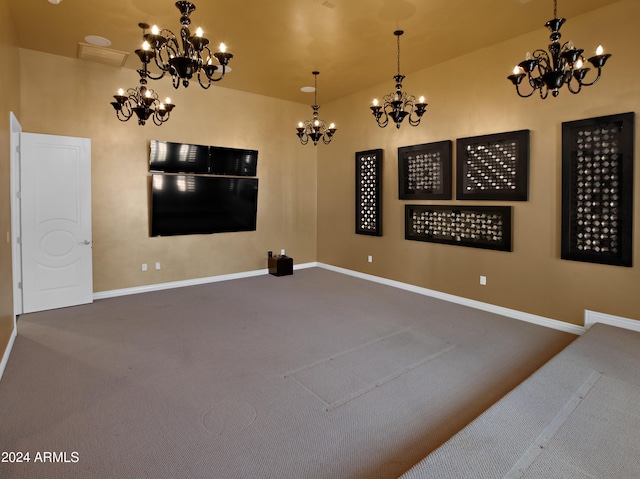 carpeted empty room with a chandelier