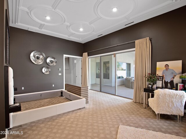 bedroom with coffered ceiling and light carpet