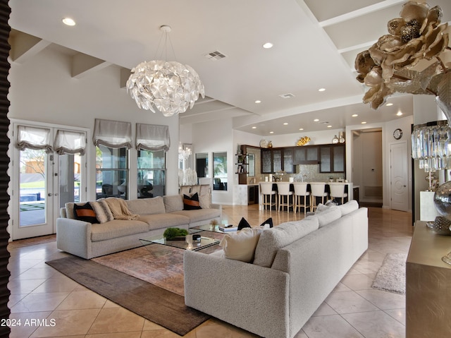 tiled living room with an inviting chandelier