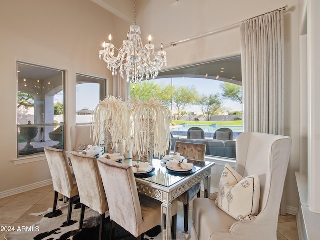 tiled dining space with plenty of natural light and a chandelier