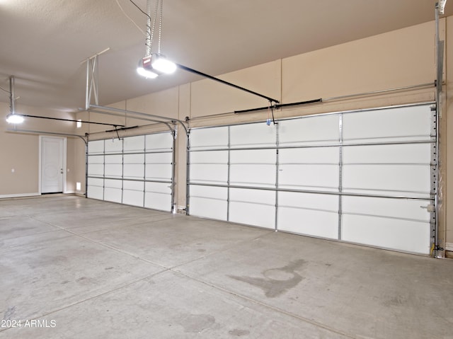 garage featuring a garage door opener