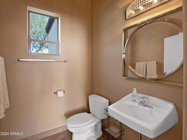 bathroom featuring sink and toilet