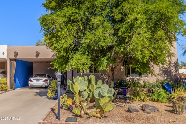 view of front of property featuring a carport